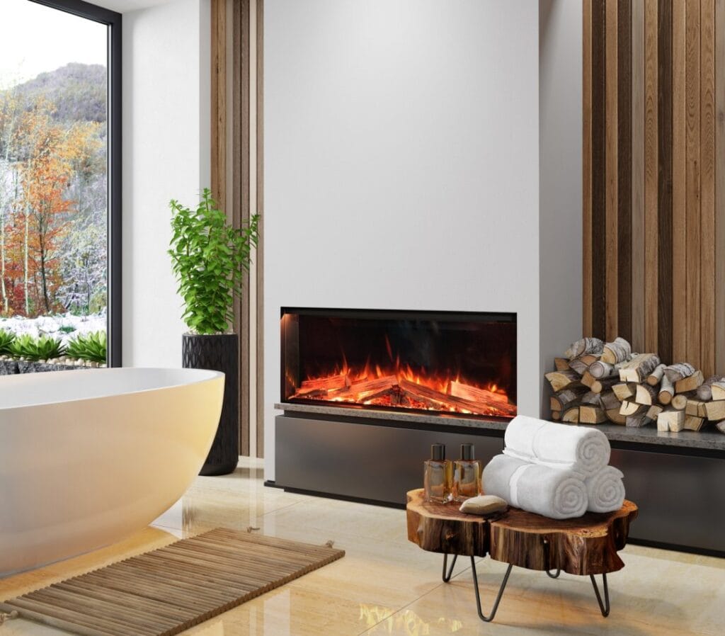 Salle de bain avec cheminée et vue extérieure automnale.